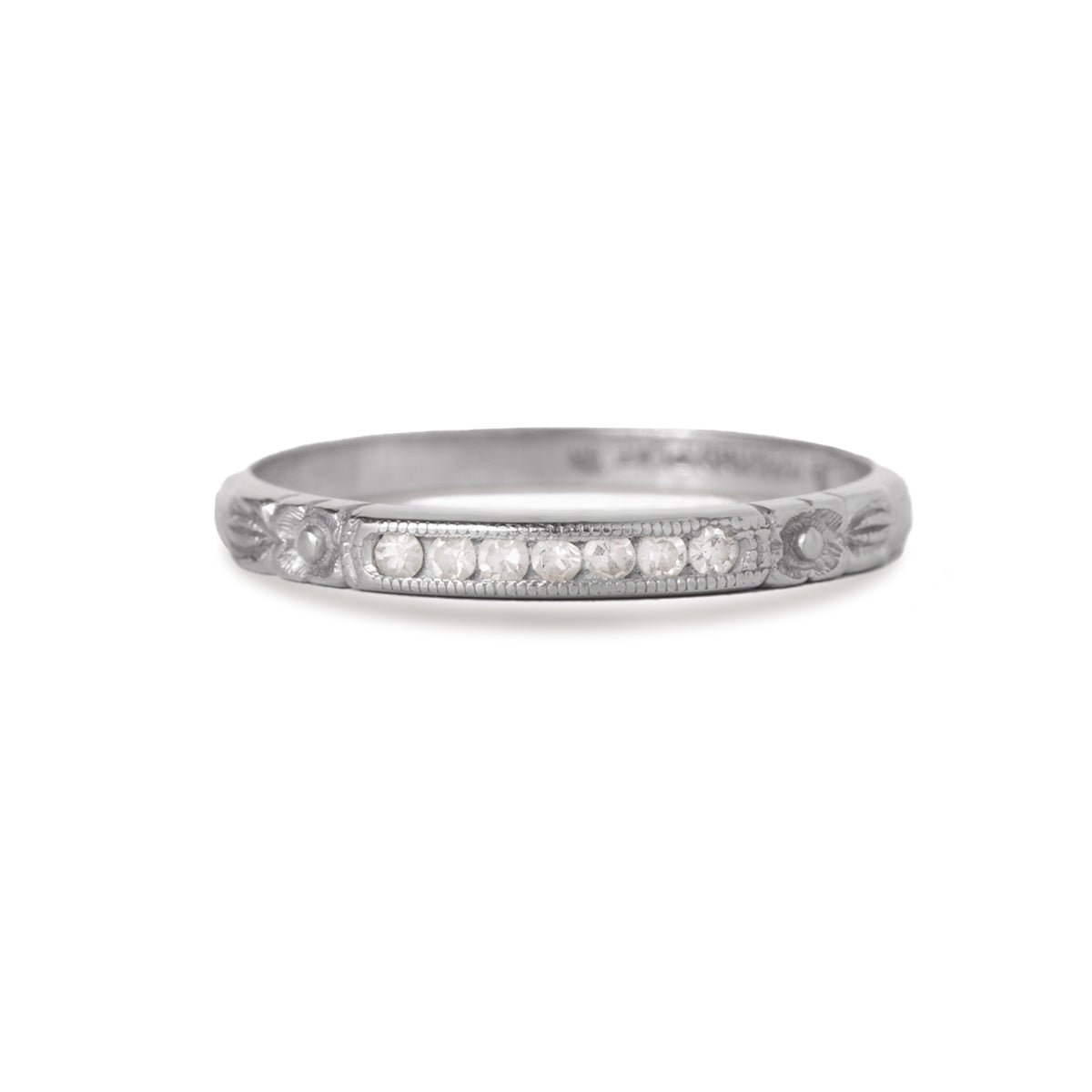 Platinum art deco diamond ring with engraved detail