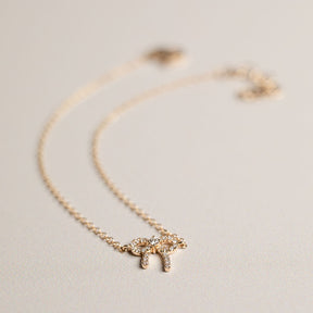 14k yellow gold diamond pave bow bracelet