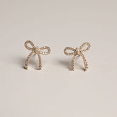 14k yellow gold diamond pave bow stud earrings