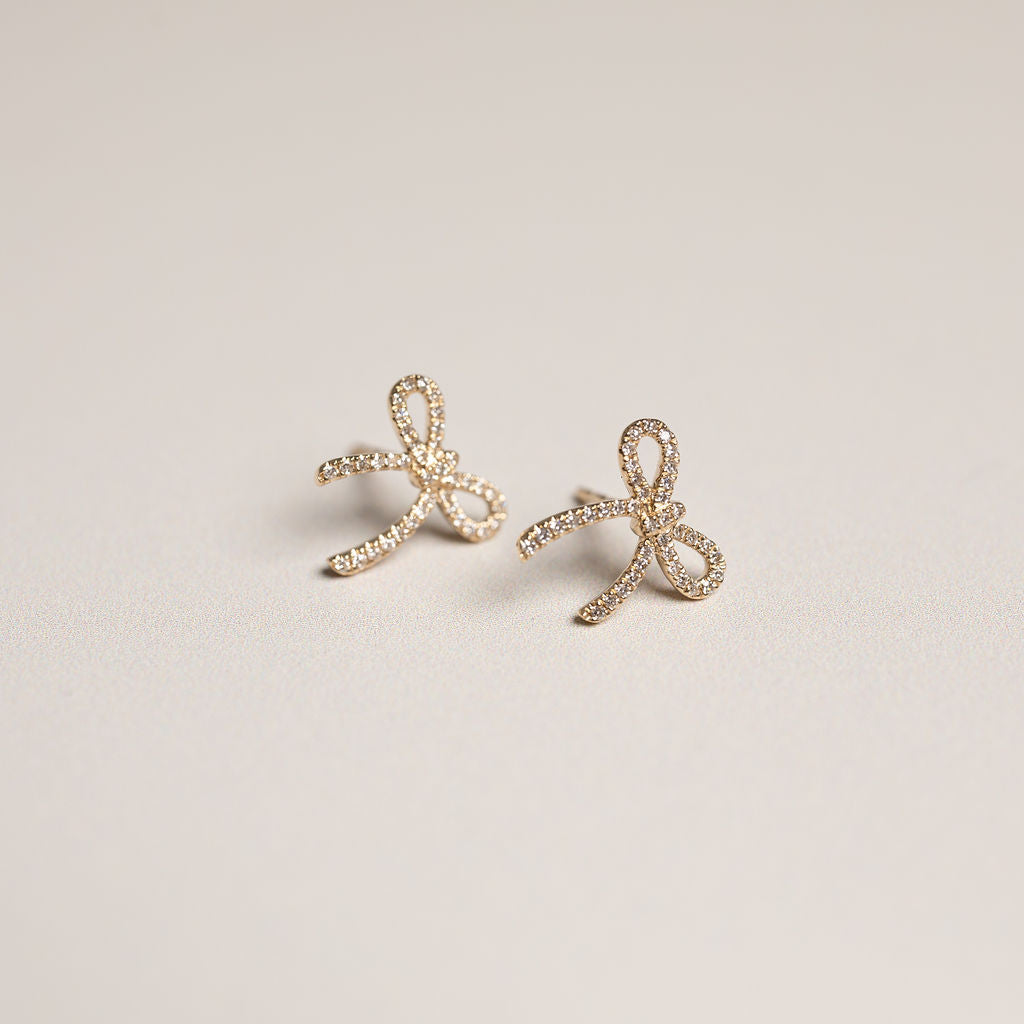 14k yellow gold diamond pave bow stud earrings