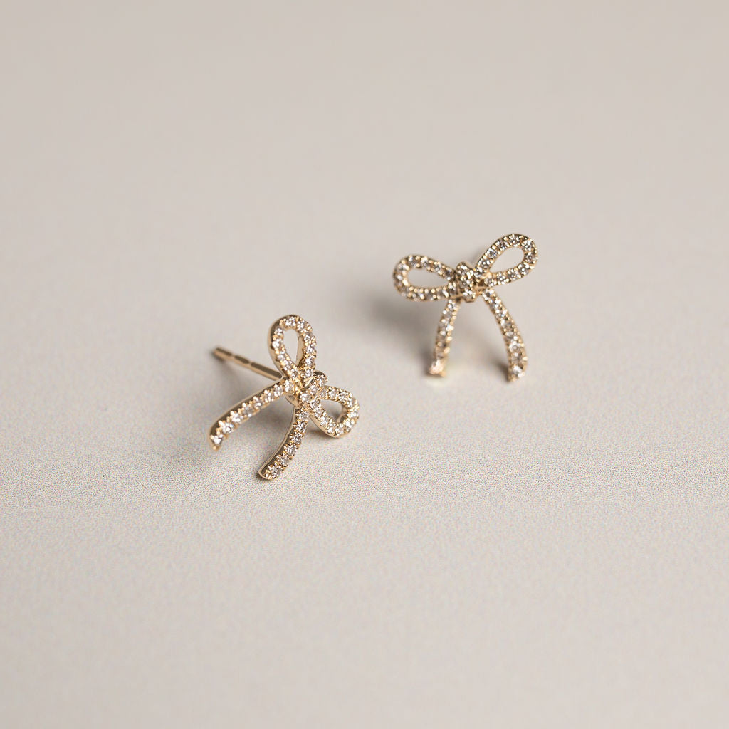 14k yellow gold diamond pave bow stud earrings