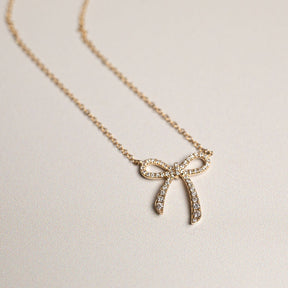 14k yellow gold diamond pave bow pendant necklace